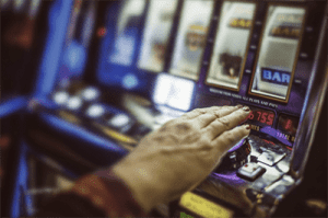 Greens vs Racing Minister over pokies Greens call for pokies transparency